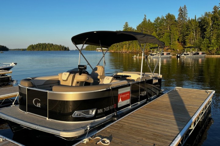 a boat is docked next to a body of water