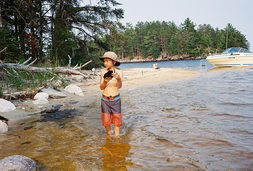 fb-img-1453059912162_orig a person standing next to a river