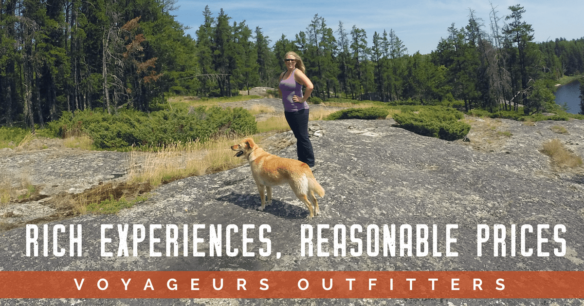 a man standing next to a dog