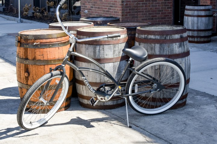 a bicycle parked in front of a brick building